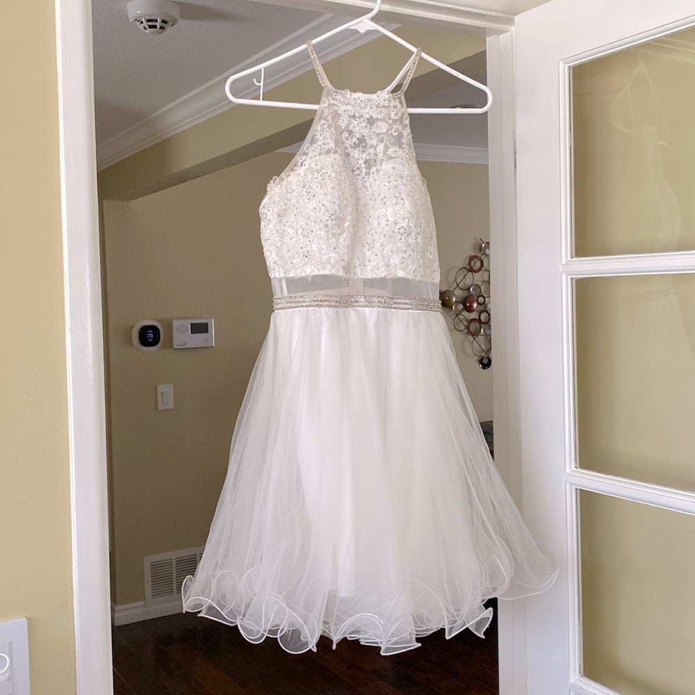 White dress size small only used once bought it for $150 and selling for $75.